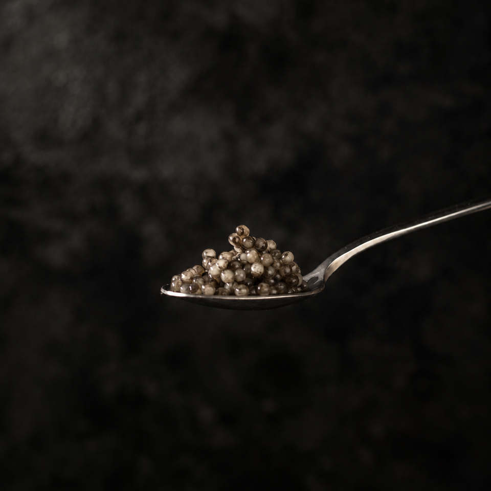 Wild Kamchatka black caviar on a metal spoon