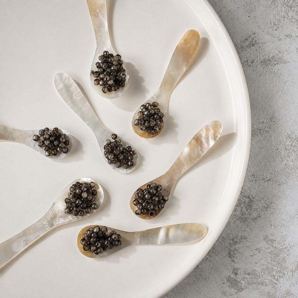 Wild Kamchatka black caviar served on mother-of-pearl spoons